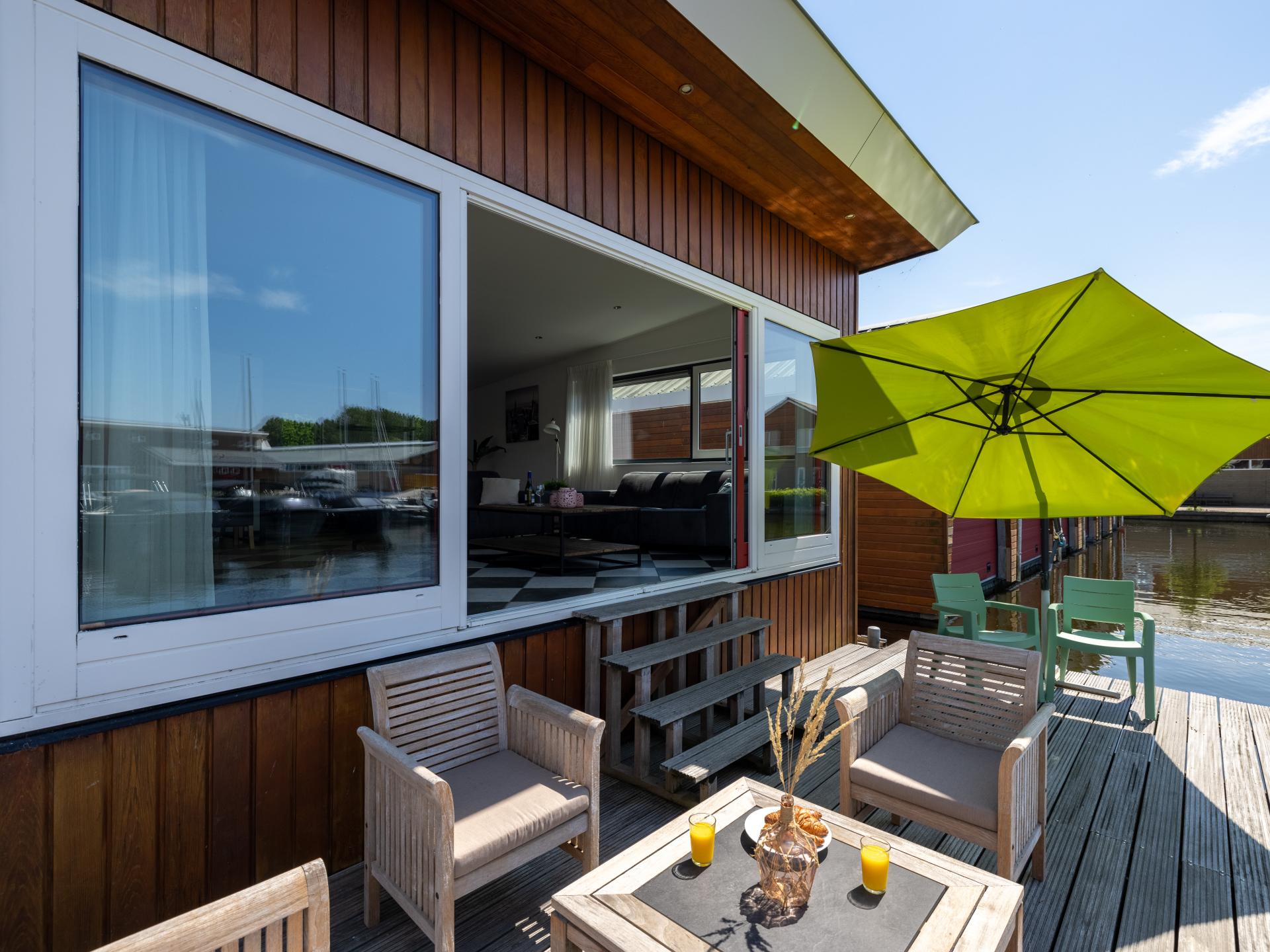 Moderne woonark aan het Uitgeestermeer met terras en jachthaven - foto 25