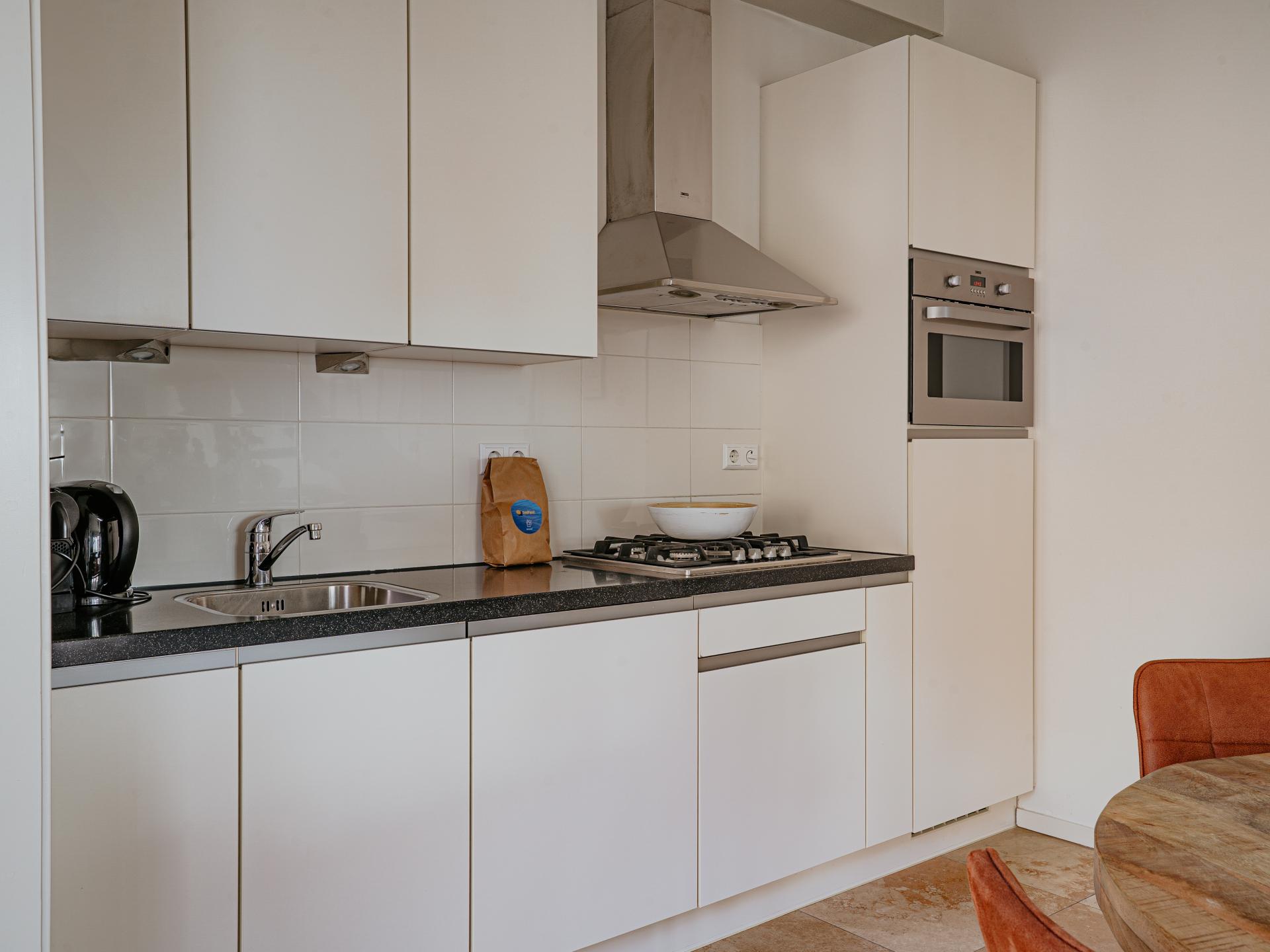 Modern vakantiehuis aan de boulevard van Egmond met zeezicht en terras - foto 11