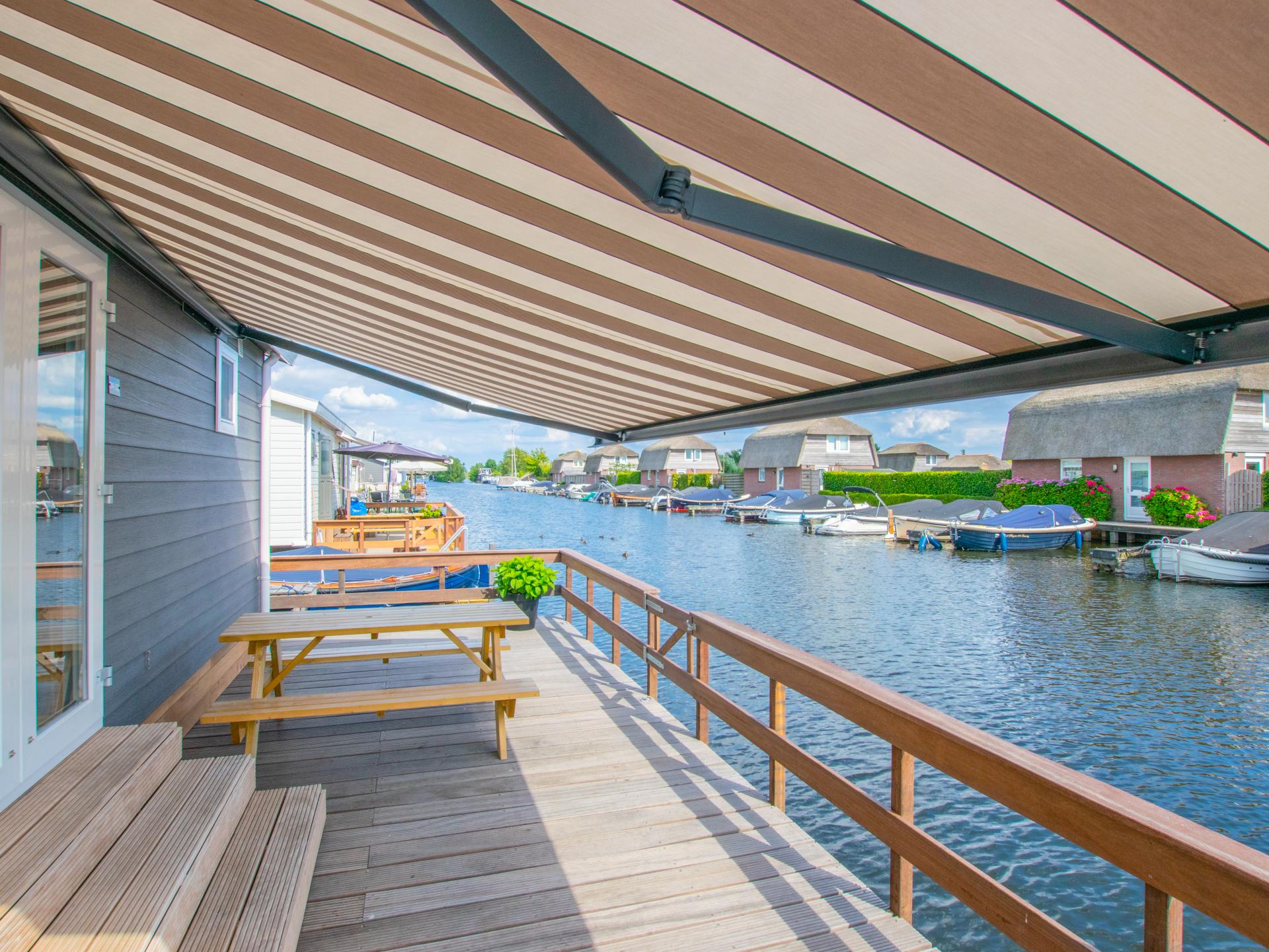 Chalet aan het water met zwemtrap en privéterras in Breukelen - foto 18