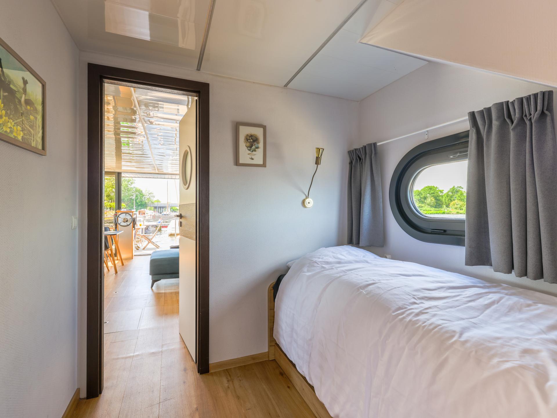 Unieke huisboot met panoramisch dakterras aan het Uitgeestermeer - foto 11