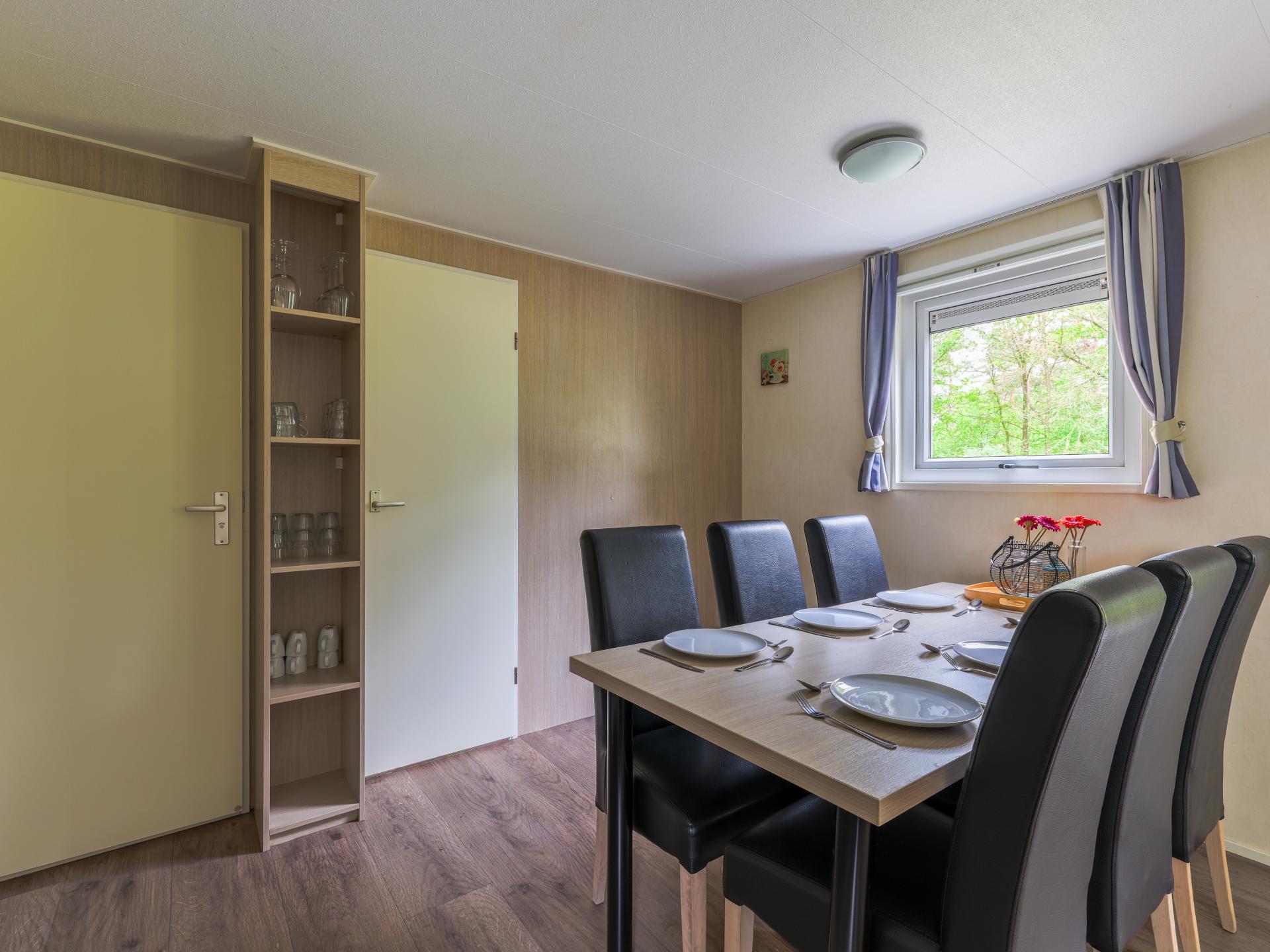 Chalet op bosrijke Brabantse camping met zwembad en avonturenpad - foto 9