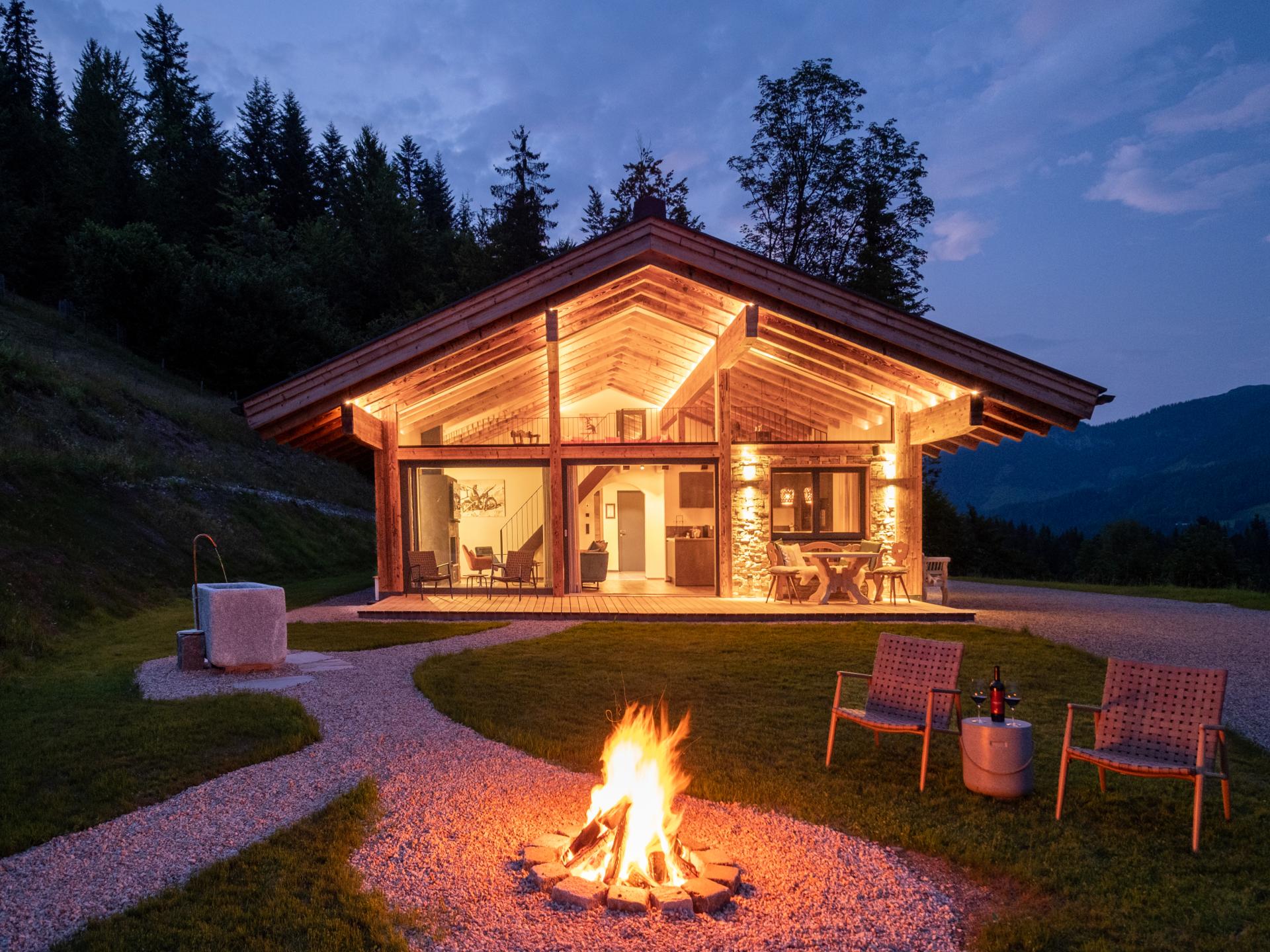 Luxe chalet in Sankt Johann met privé sauna en natuurlijke zwemvijver - foto 11