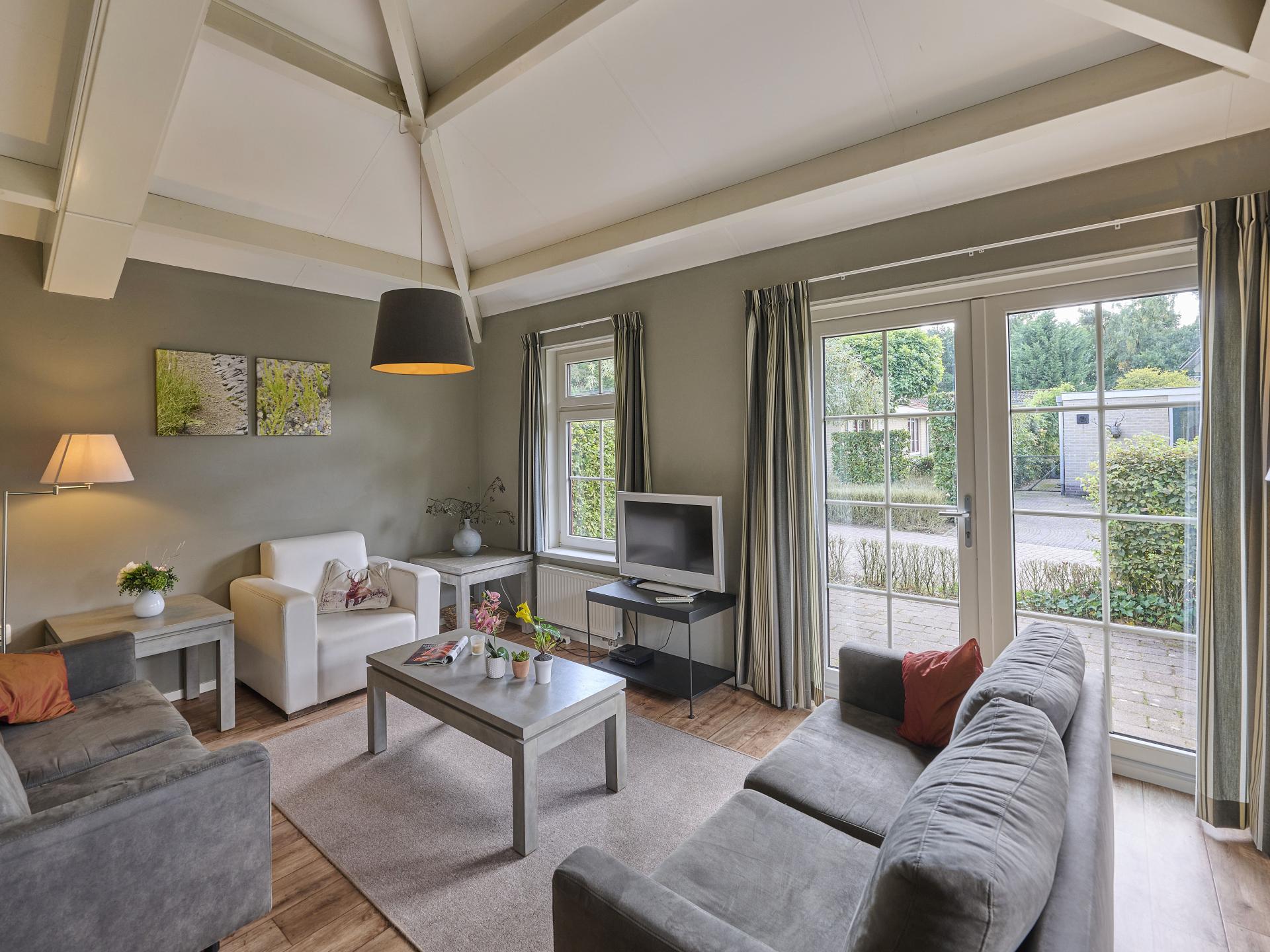 Vrijstaande villa aan bosrand op Veluws vakantiepark voor 8 personen - foto 14