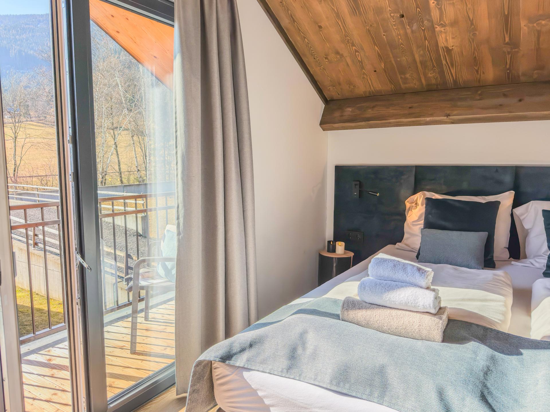 Chalet aan de Afritzer See met privé sauna en uitzicht op de Alpen - foto 13