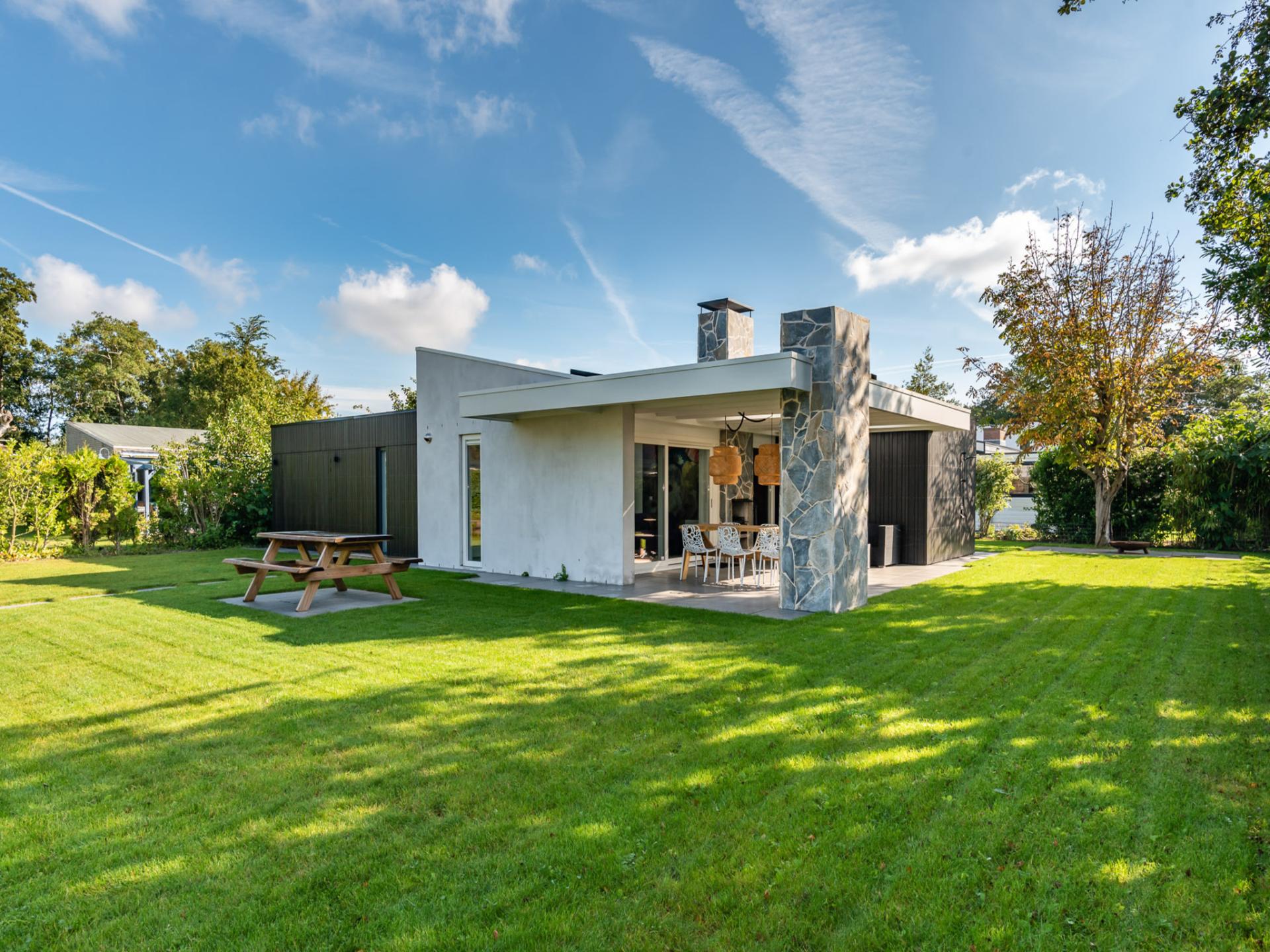 Luxe bungalow aan het Veerse Meer met overdekt terras en buitenhaard - foto 24