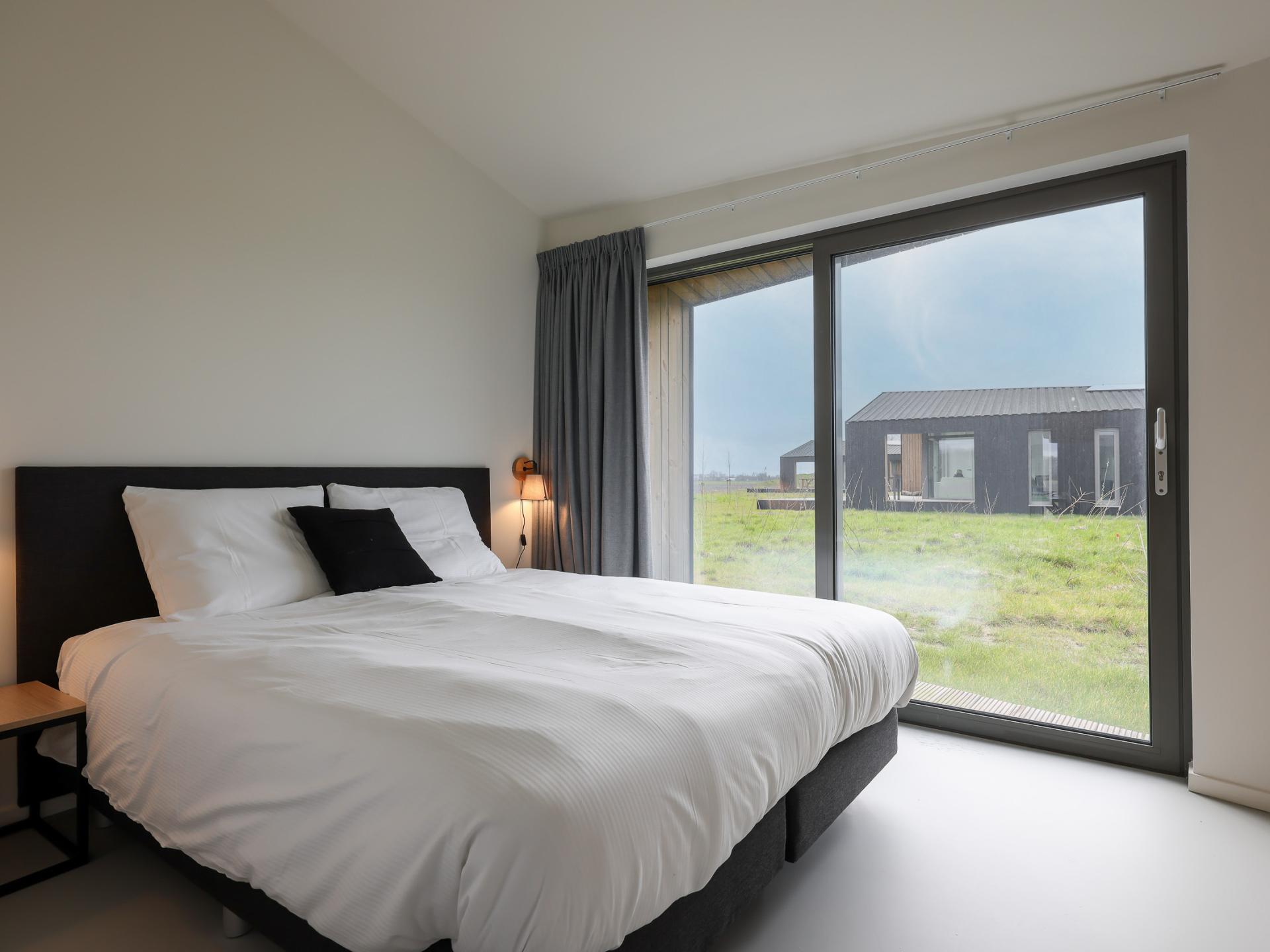 Vrijstaand natuurhuis in Zeeuws polderlandschap met uitzicht over de velden - foto 24