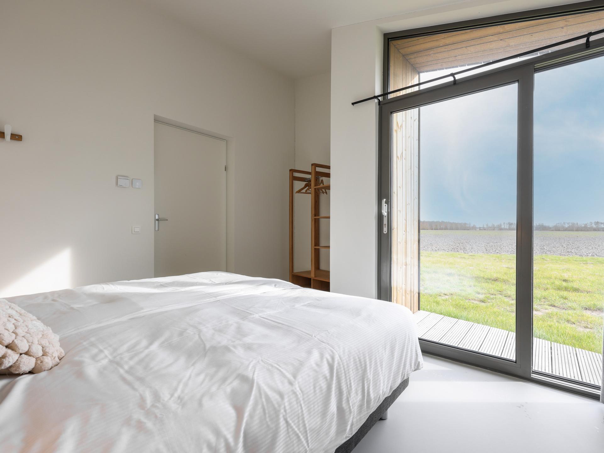 Vrijstaand natuurhuis in Zeeuws polderlandschap met uitzicht over de velden - foto 25