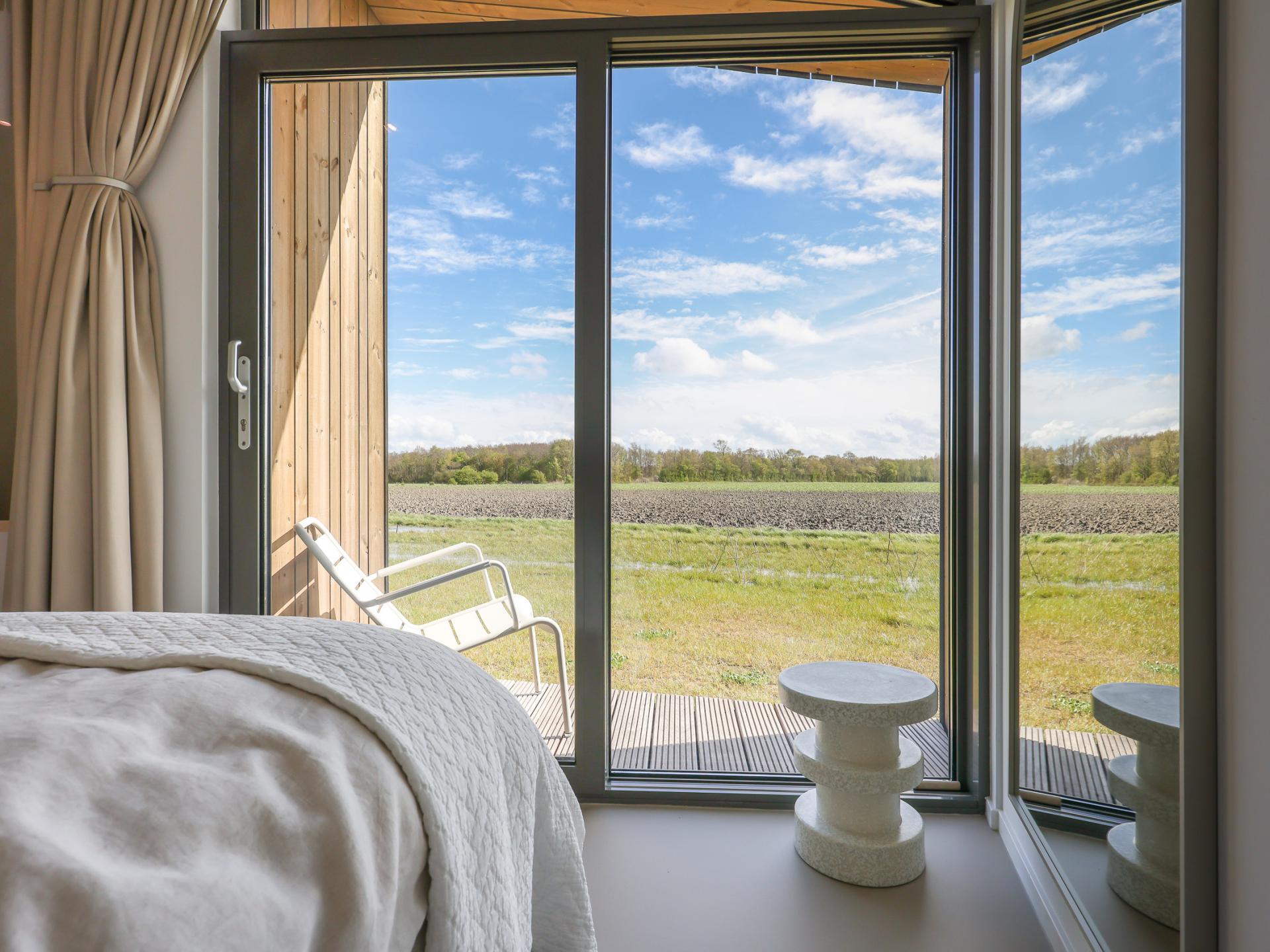 Natuurhuis met panoramisch terras aan het water in rustig Zeeland - foto 32