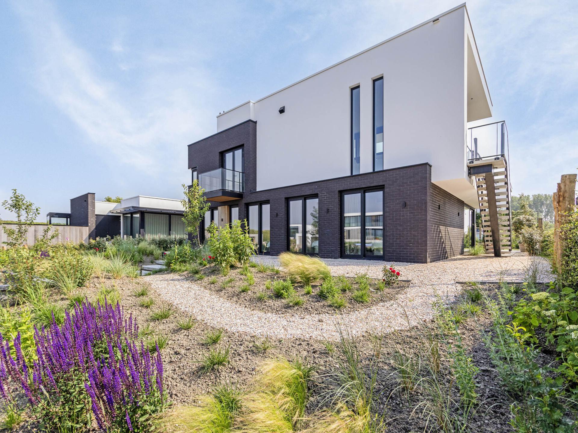 Luxe watervilla met zwembad en steiger aan het water in Kamperland - foto 30