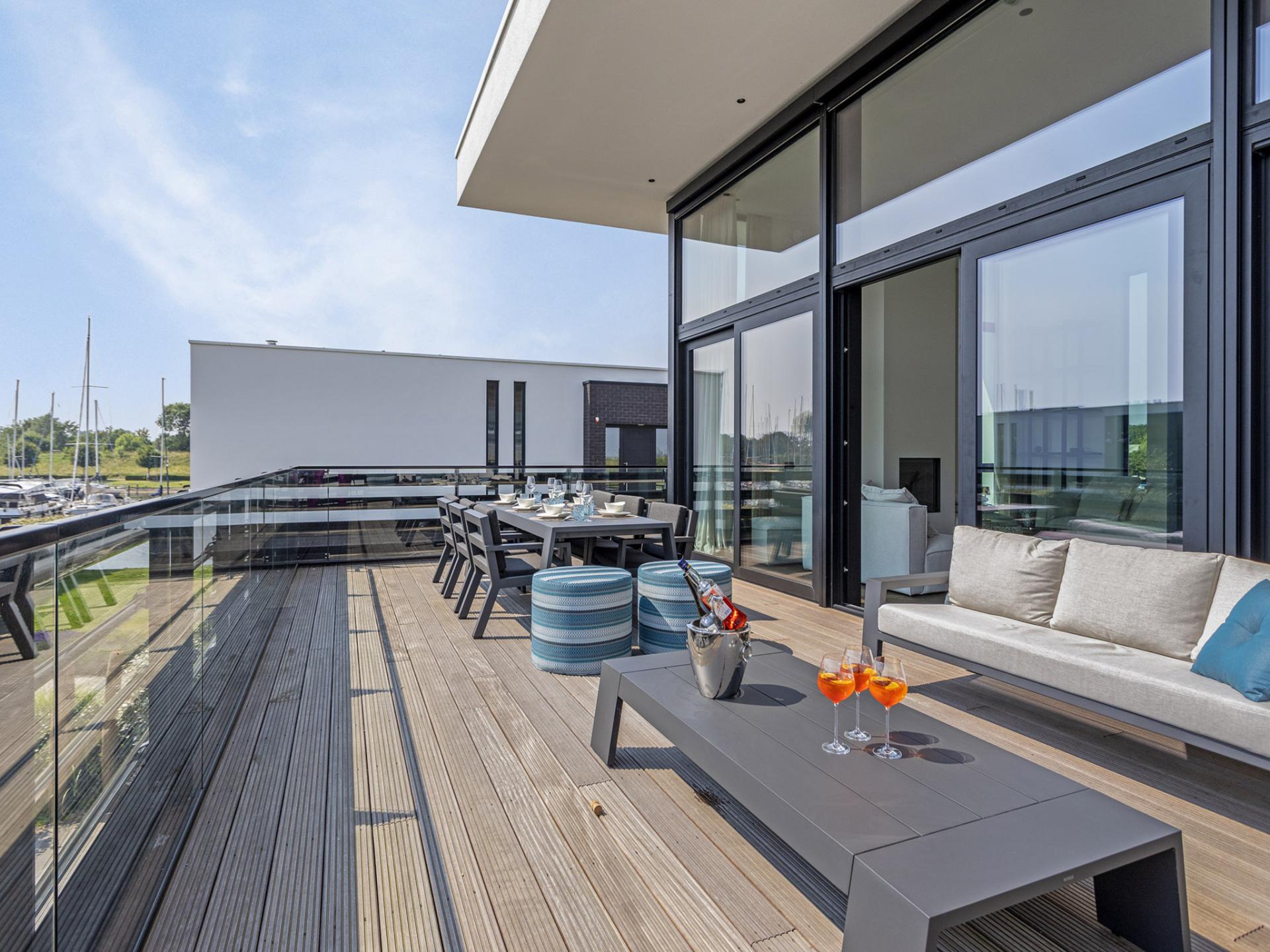 Luxe watervilla met zwembad en steiger aan het water in Kamperland - foto 31