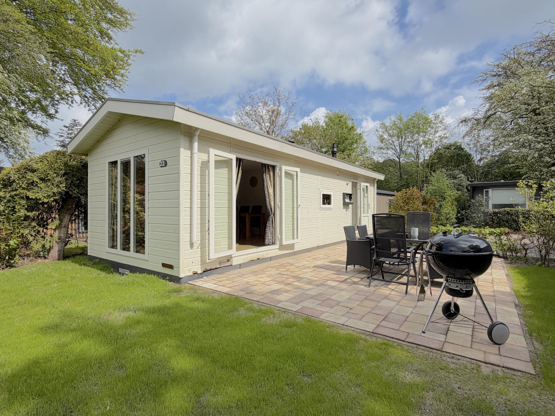 Knus chalet aan de bosrand met zonnig terras in Hulshorst - foto 16