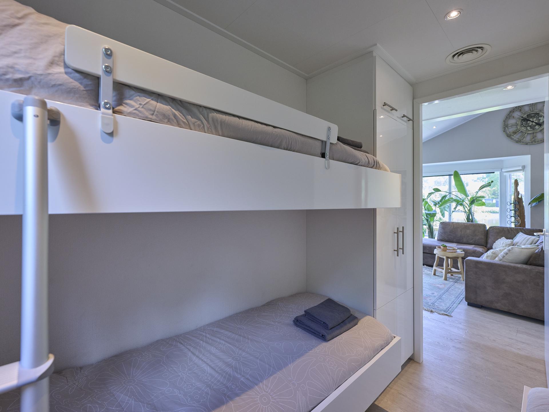 Modern vakantiehuis aan het water met privéjacuzzi op de Veluwe - foto 25