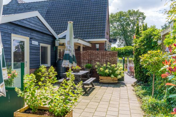 Reggezicht: nieuw vakantiehuis met enorme tuin in hartje Hellendoorn - thumbnail 1