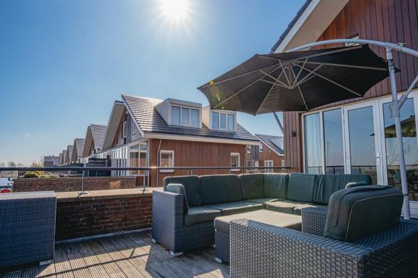 Modern waterappartement met vrij uitzicht in Uitgeest, 170m van centrum - thumbnail 1