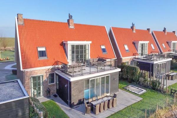 Luxe villa met privézwembad en sauna op 500m van het strand in Zeeland - thumbnail 1
