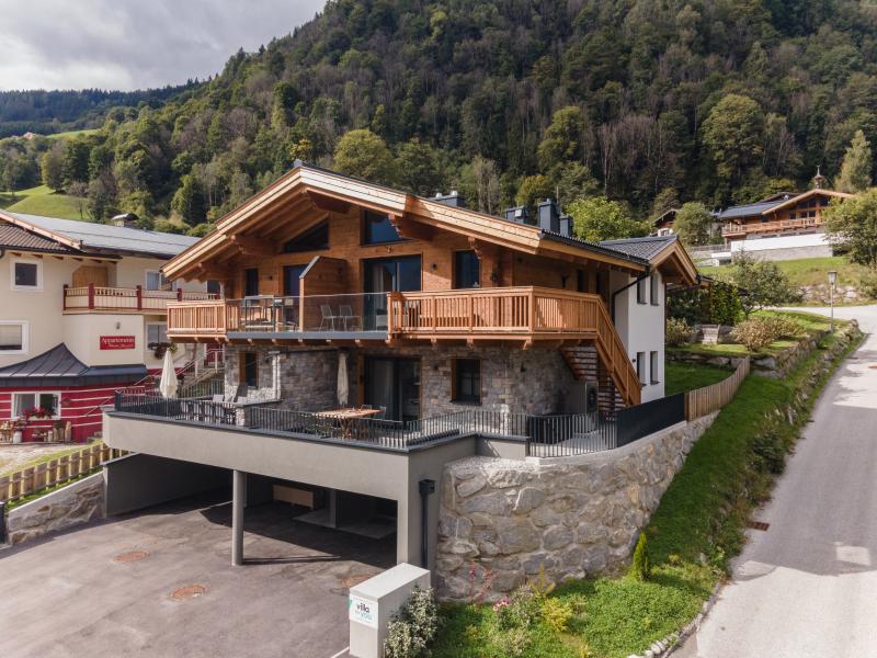 Ski-in/ski-out luxe lodge met balkon, terras en tuin
