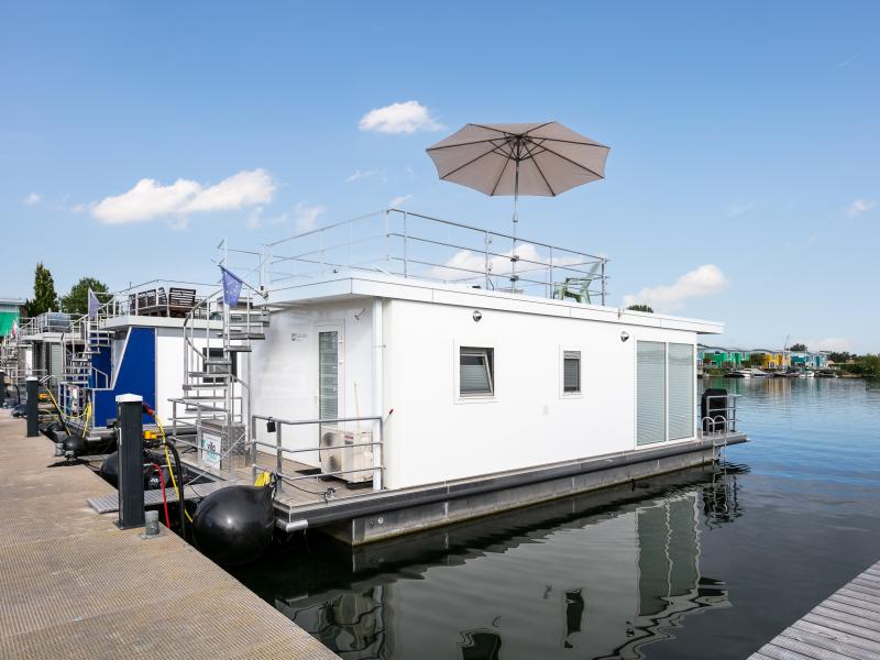 Modern houseboat with air conditioning in port
