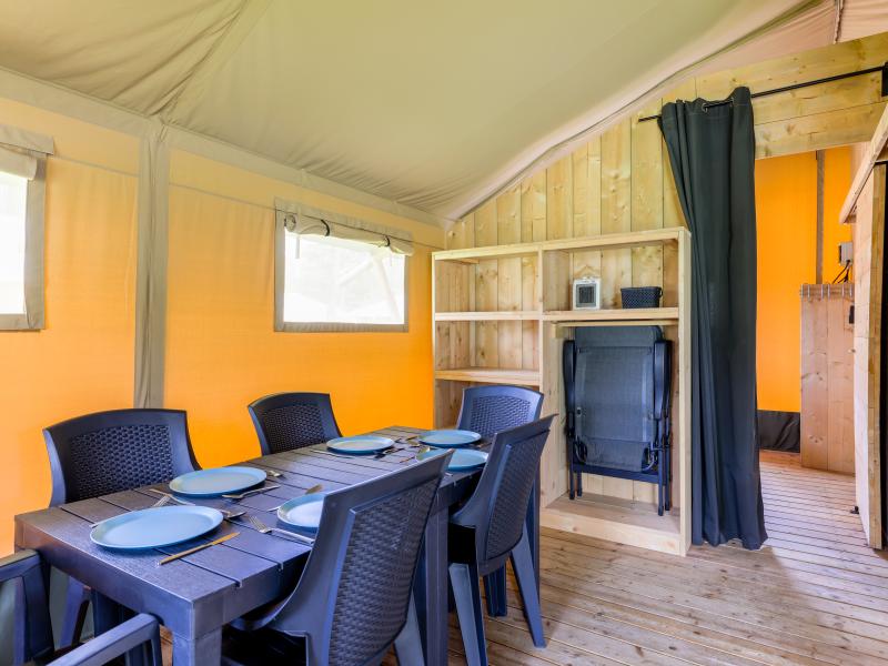 Glamping tent on campsite with swimming pool