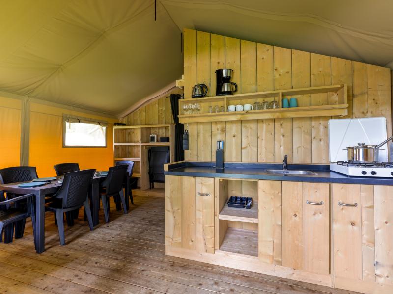 Glamping tent on campsite with swimming pool