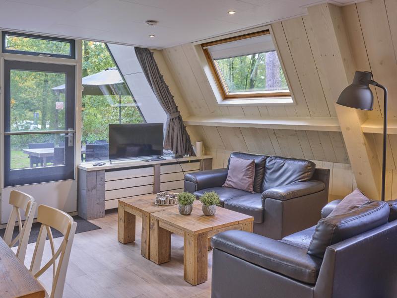 Gezellige bungalow met sauna in bosgebied