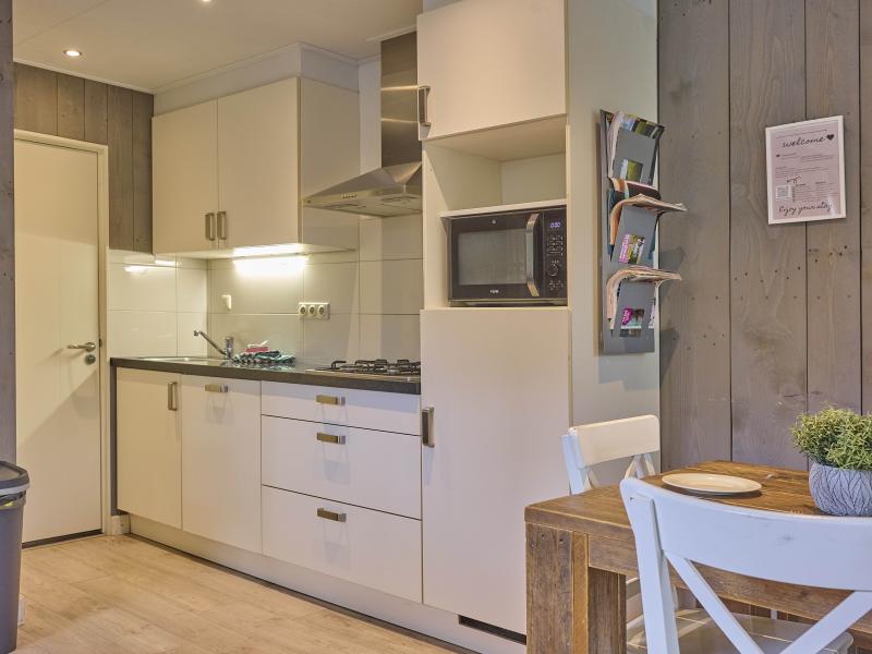 Gezellige bungalow met sauna in bosgebied